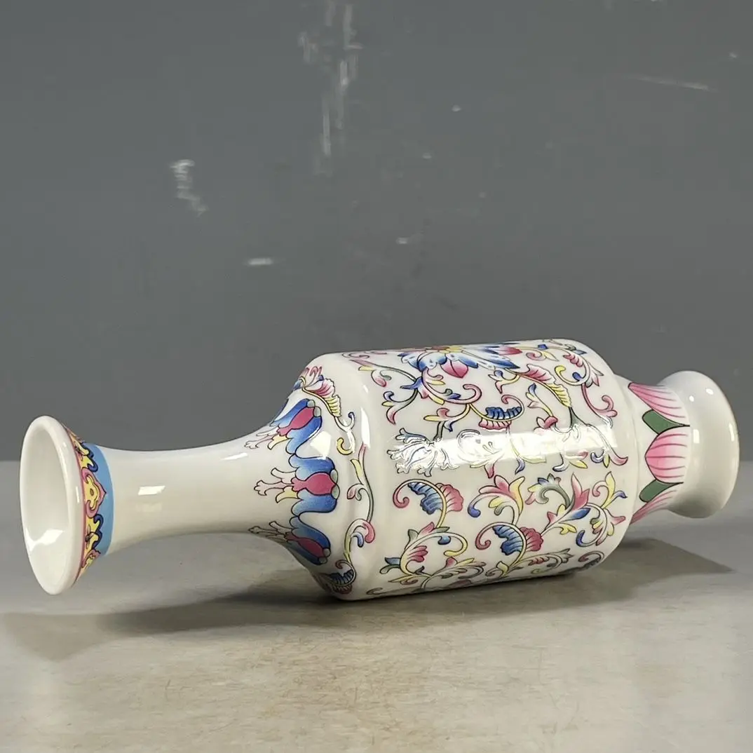 Replica of Chinese-style porcelain, Qing Dynasty Qianlong period white-glazed vase with intertwined floral design.