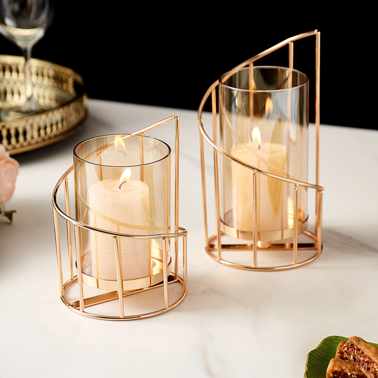 New Enhance your living space with stunning sophistication and luxurious charm by adding this exquisite gold metal candle holder