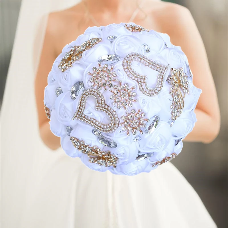 white wedding holding flowers