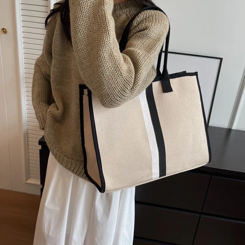 Bolso de hombro de lona de gran capacidad para mujer, bolso de viaje diario, diseño Simple, estética, estudiante, tendencia informal, combina con todo