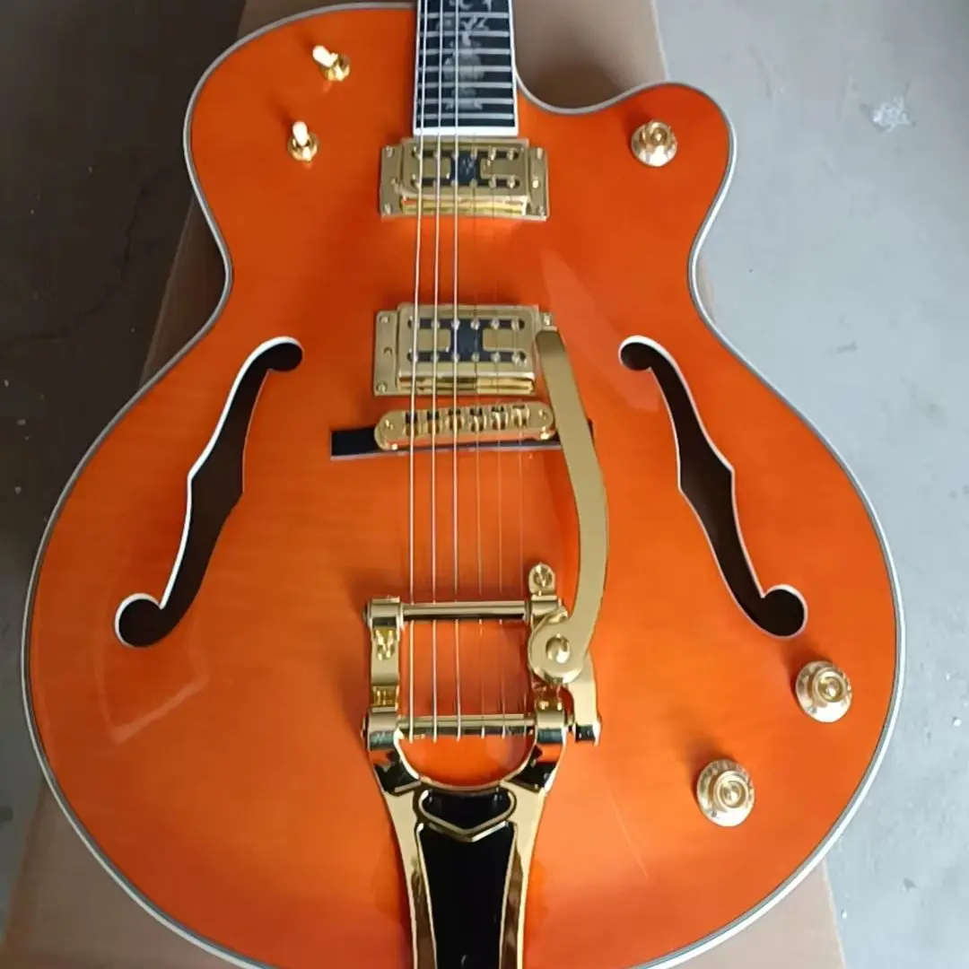 

144 orange 6 string gold hardware with guard plate and trills free shipping