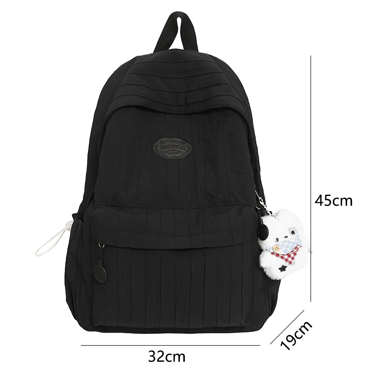 Coreano náilon mochila feminina casual cor sólida pequena mochila de viagem para adolescente mochila escolar com decoração boneca