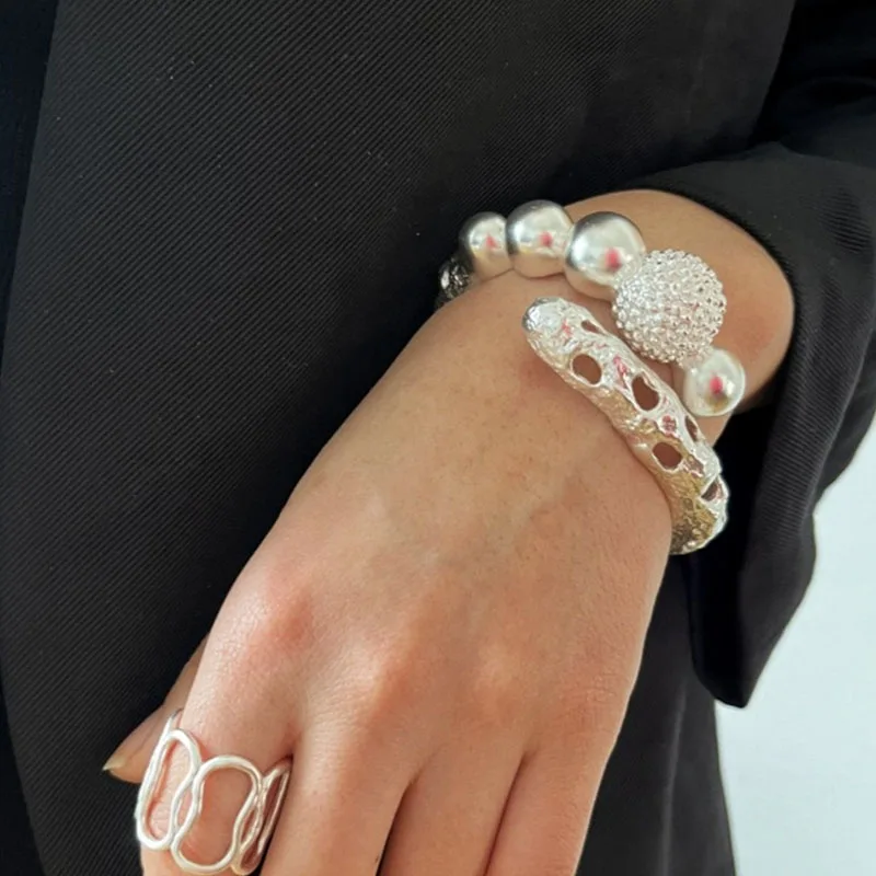 Hollow-textured spherical bangles for women spring ball vintage bangles elegant designer jewelry new in 2026