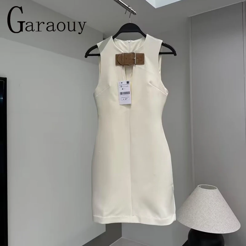 Garaouy Woman Sleeveless Back Zipper White Slim Short Dress Female Elegant Sexy Hollow Out O Neck Leather Buckle Chic Mini Dress