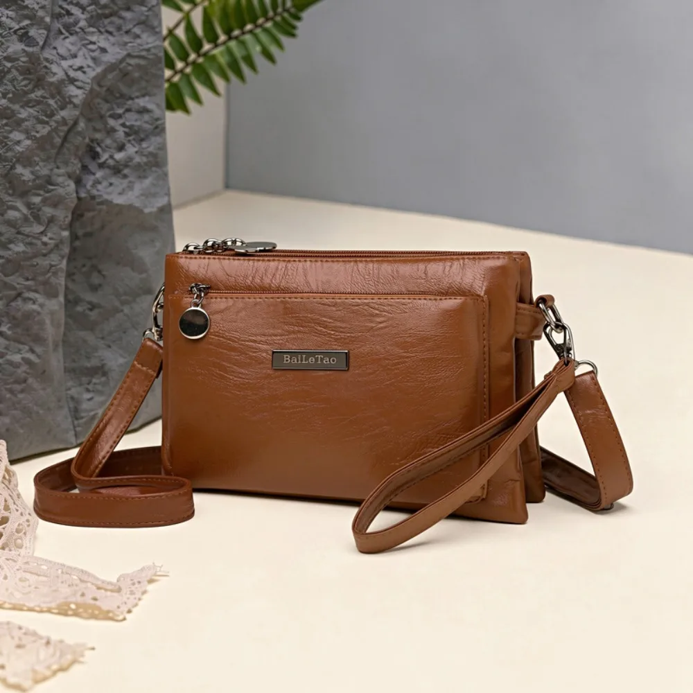 Bolso cruzado para mujer, bolso de tamaño universal con diseño de cremallera, tonos bronce, rosa empolvado y tostado, práctico para el uso diario.