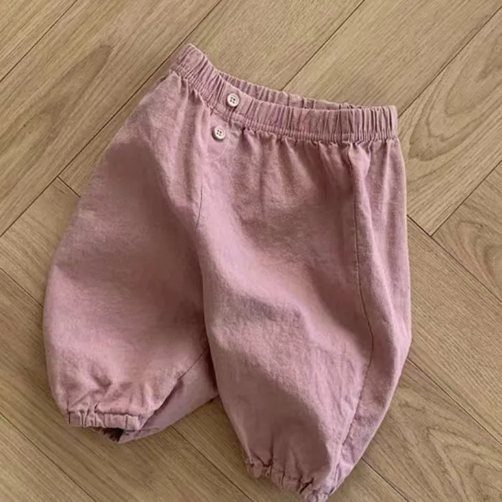 Pantaloni per bambini ragazzi coreani ragazze bambino traspirante tinta unita Versatile morbido Comfort elastico in vita 2024 bottone moda sciolto