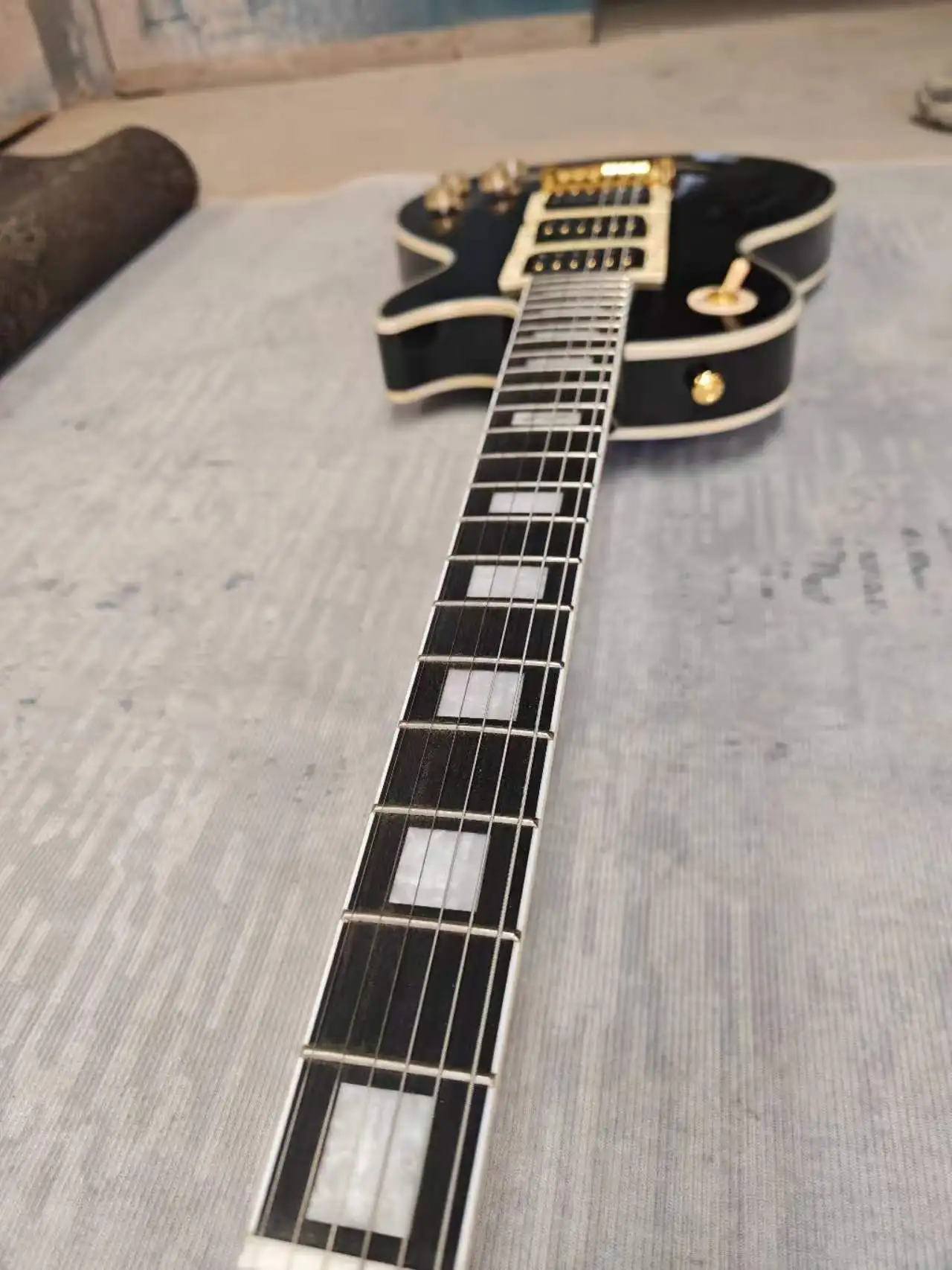 

Electric guitar made in China, black color, 12F signature, 3 pickups