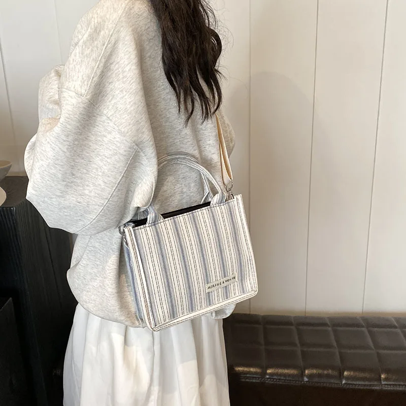 2024 New women\'s shoulder bag Square bag Fashion matching color striped pattern Delicate compact high-end design Mom Female girl