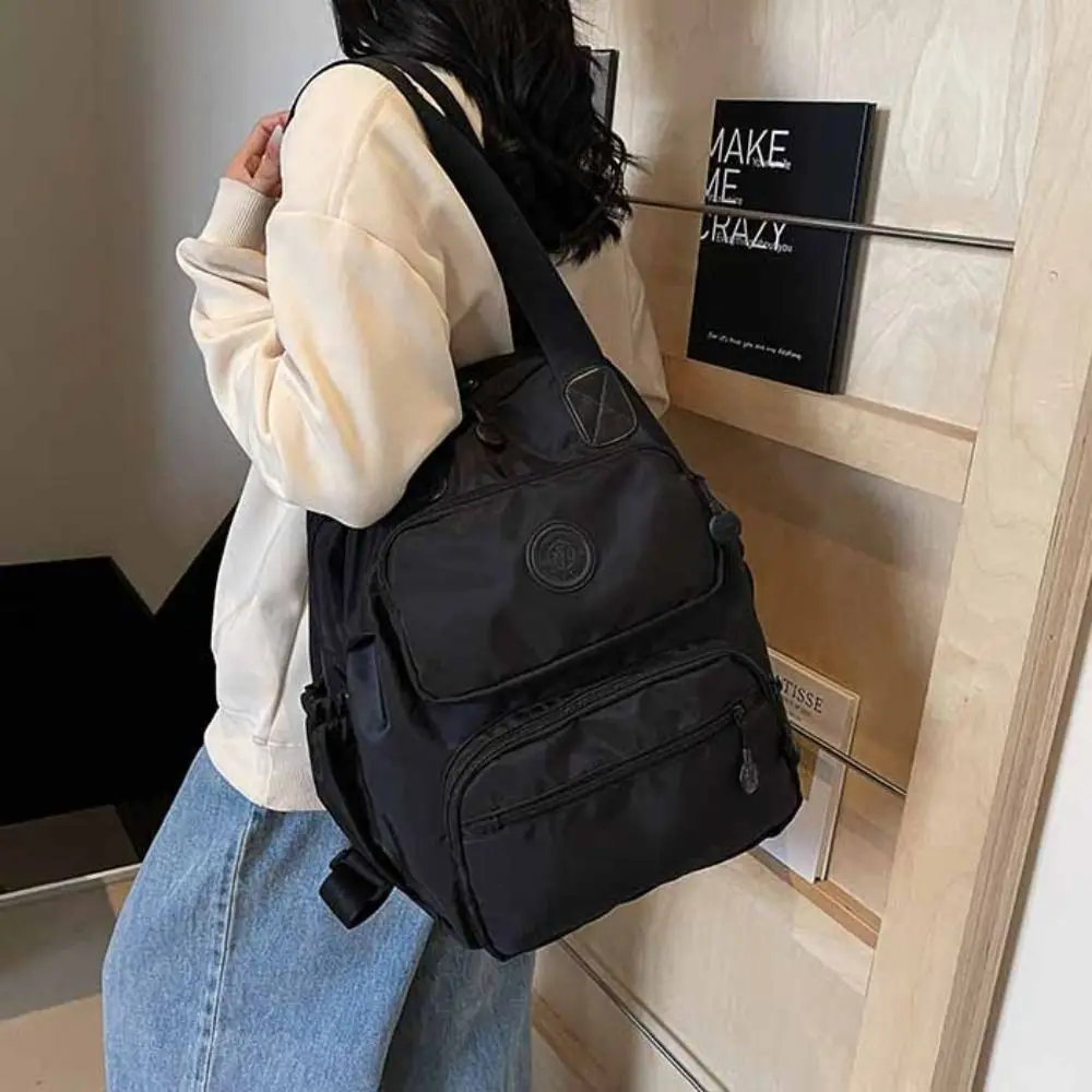 

Casual Korean Style Sport Nylon Backpack Large Capacity Nylon Travel Shoulder Bag Solid Color Niche Design Fitness Bag Travel