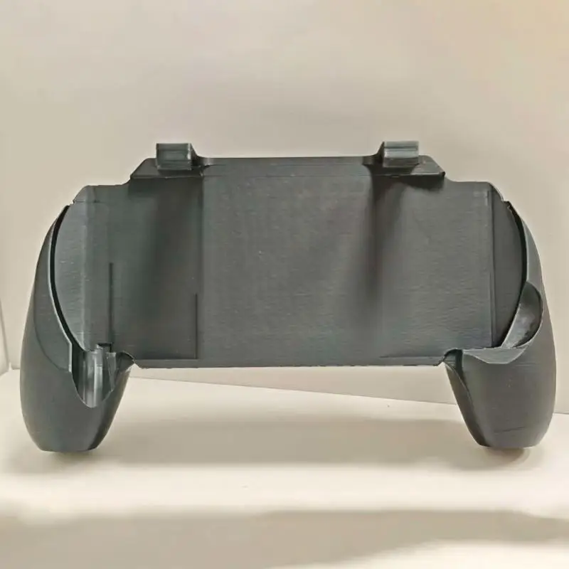 Controller-Style Grip for 1000 Handheld Gaming Devices, Featuring Textured Handle Surfaces, Contoured Edges, and Shaped D2RC