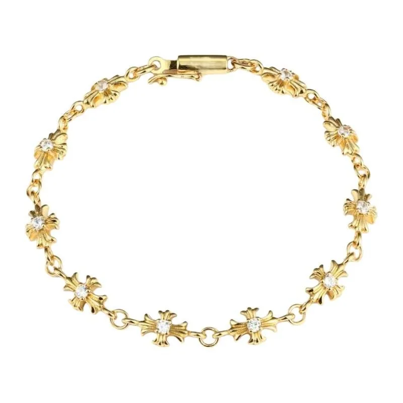 

Золотой браслет с крестом и хрустальными акцентами: элегантные эффектные украшения