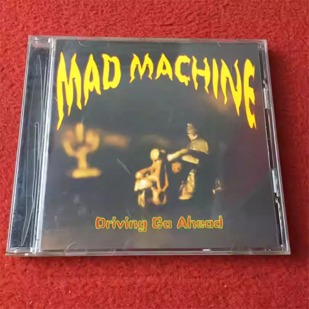 

CD 'Driving Go Ahead ' Is A Studio Album By Mad Machine, A Project Rooted in Garage Rock, Punk Rock, and Psychedelic Rock.