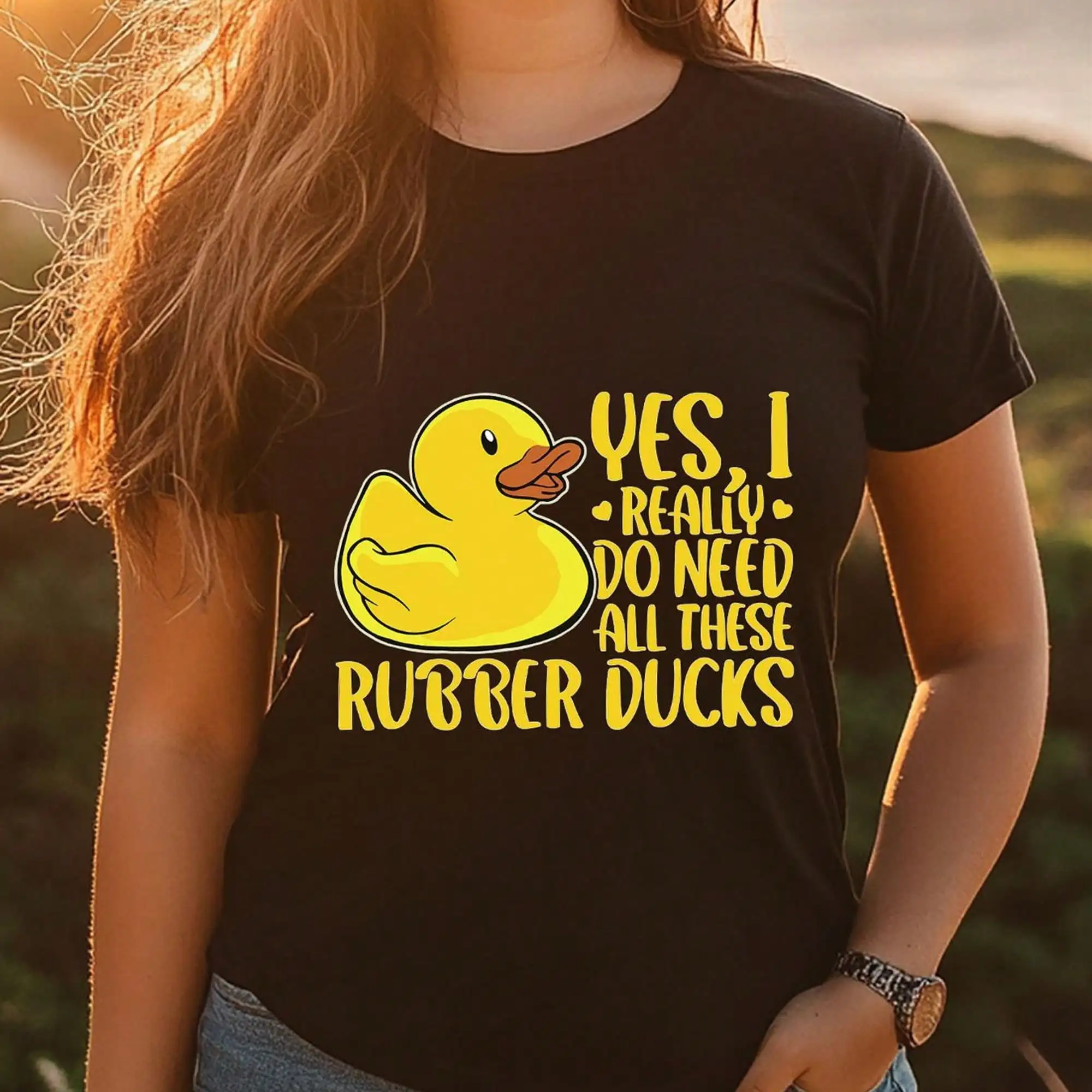 Black T-Shirt For Women Featuring An Adorable Duck Graphic - YES, I TRULY REQUIRE ALL THE Rubber Ducks. This Humorous Design Includes Short Sleeves And A Round Neck, Making It A Casual Autumn Top For Adults