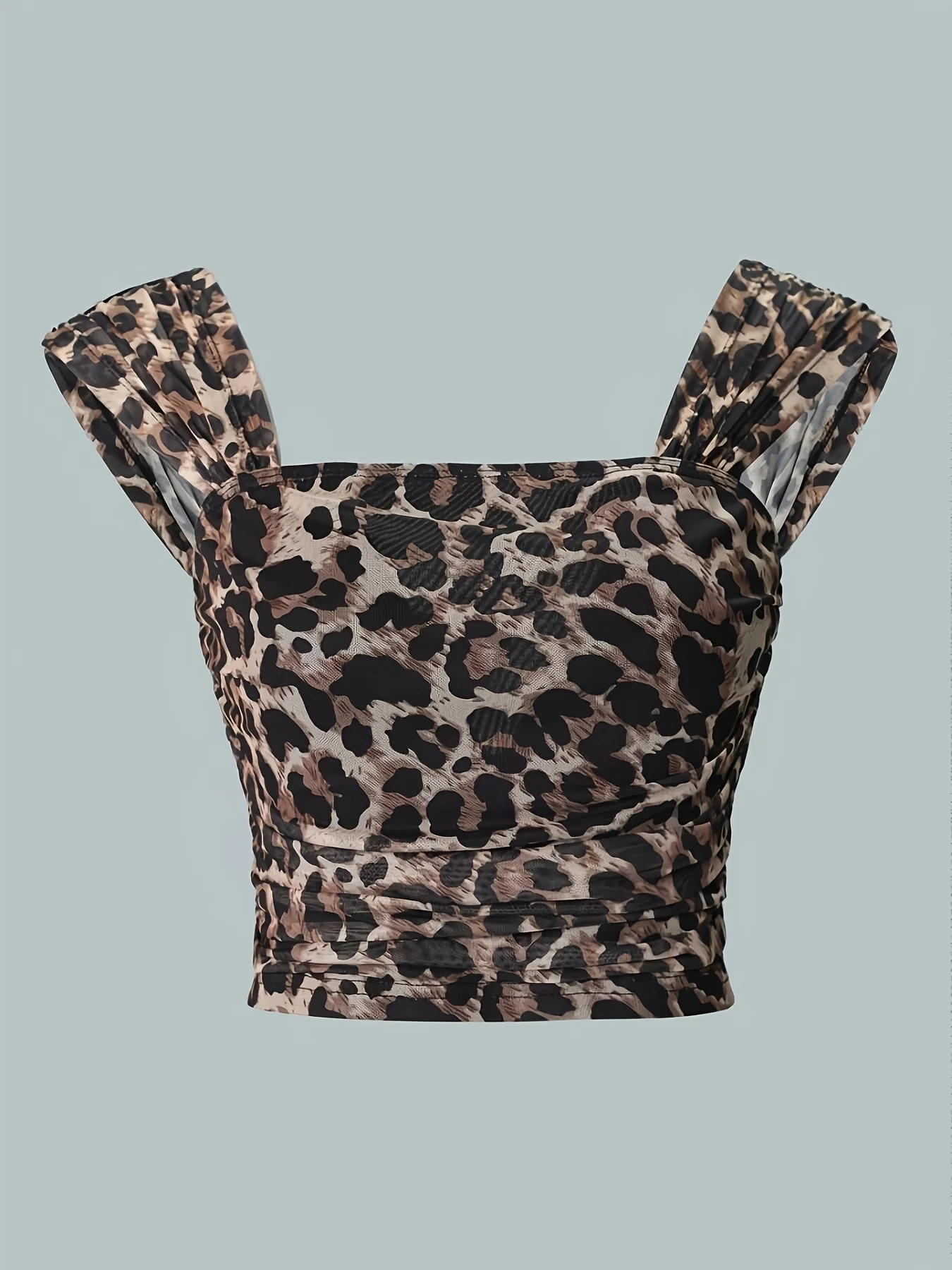 Lady with sexy and elegant backless, stretchy, frilly leopard print top