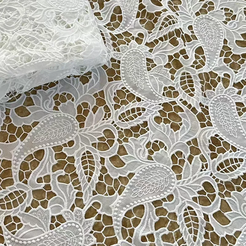 

Latest gorgeous milk silk water-soluble hollow embroidery paisley lace fabric Nigerian lace fabric for wedding dresses gowns