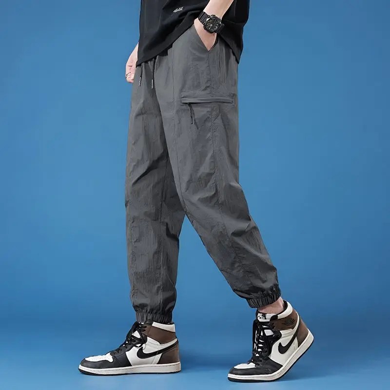 

High Quality Summer Thin Men's Loose Tapered Harem Pants Zippered Pocket Cargo Pants Quick-Dry Elastic Waist Trousers Male 4XL