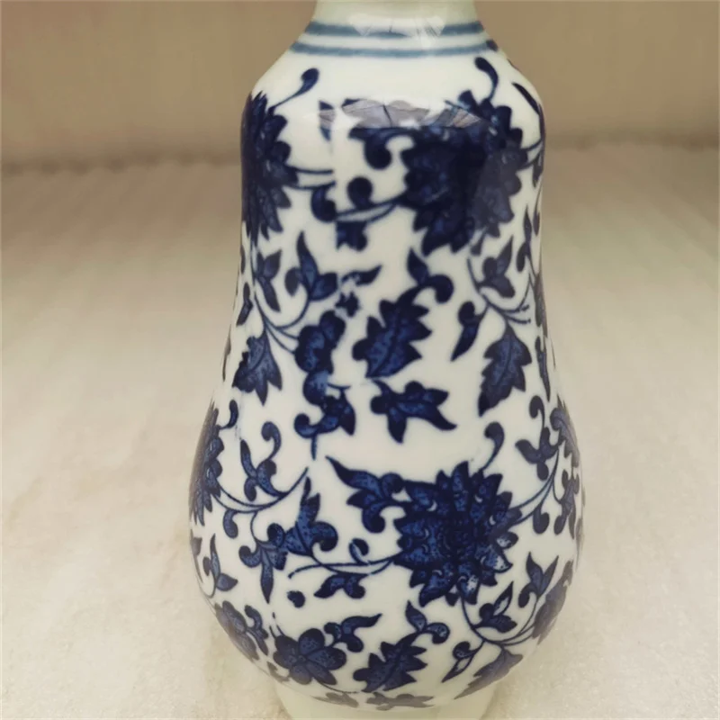 Antique Blue And White Porcelain Vase with Entangled Lotus Pattern Slender Waist Design Traditional Chinese Ceramic Art