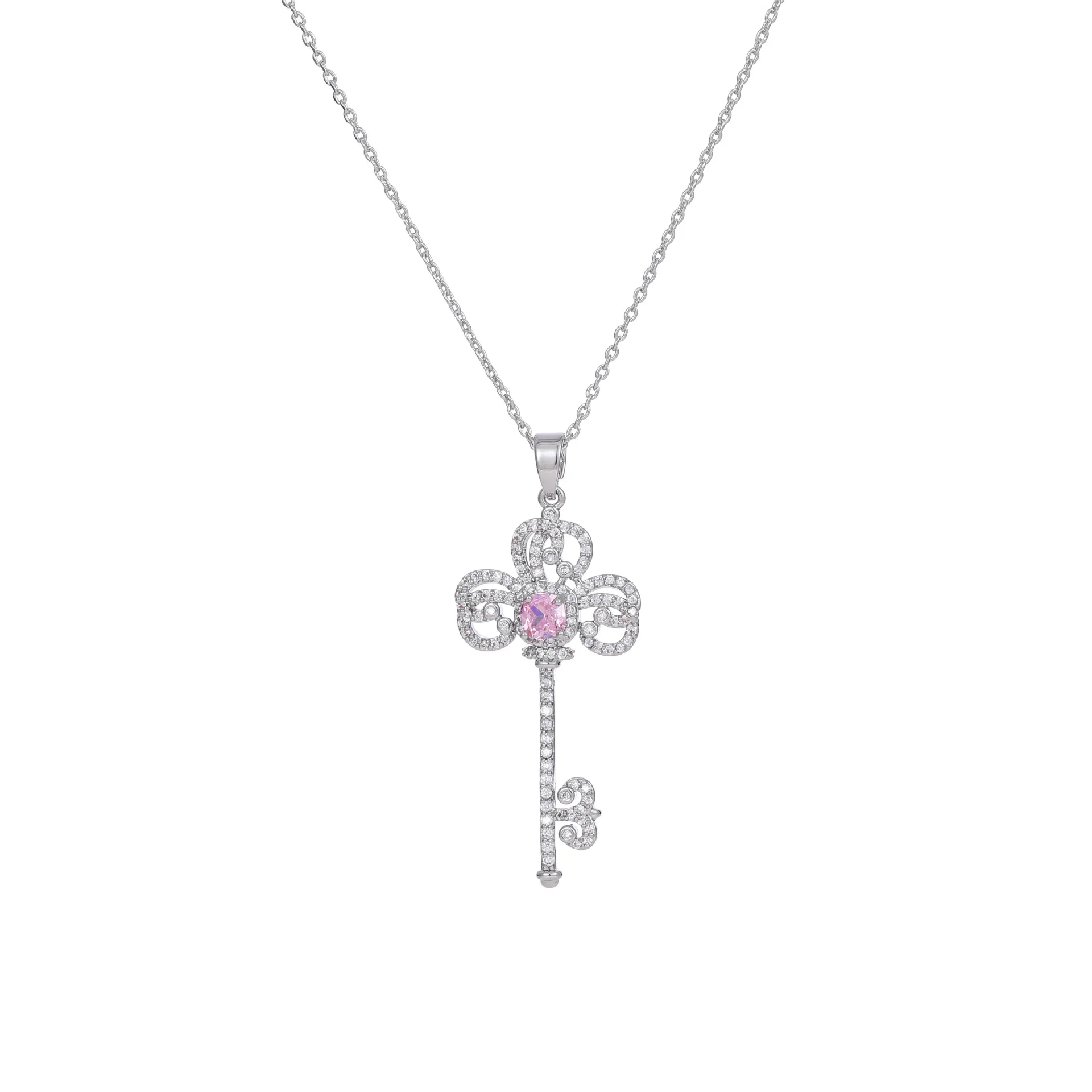 A one-shoulder necklace dress paired with a trendy and high-end designer key collarbone chain