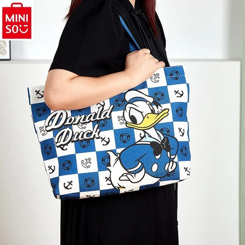 

MINISO Disney Canvas Cartoon Donald Duck Stitch Tutorial Bag Large Capacity Shoulder Bag Children's Handheld Book Bag