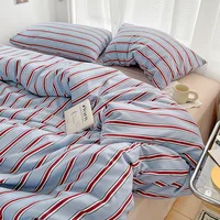 Simple Red and Blue Striped Duvet Cover and Four Piece Bed Sheet Set with Washed Cotton Bedding on the Bed