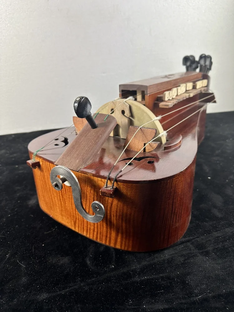 

Hurdy Gurdy is inlaid with 6-stringed 24 key shells, handmade maple and ebony, factory produced