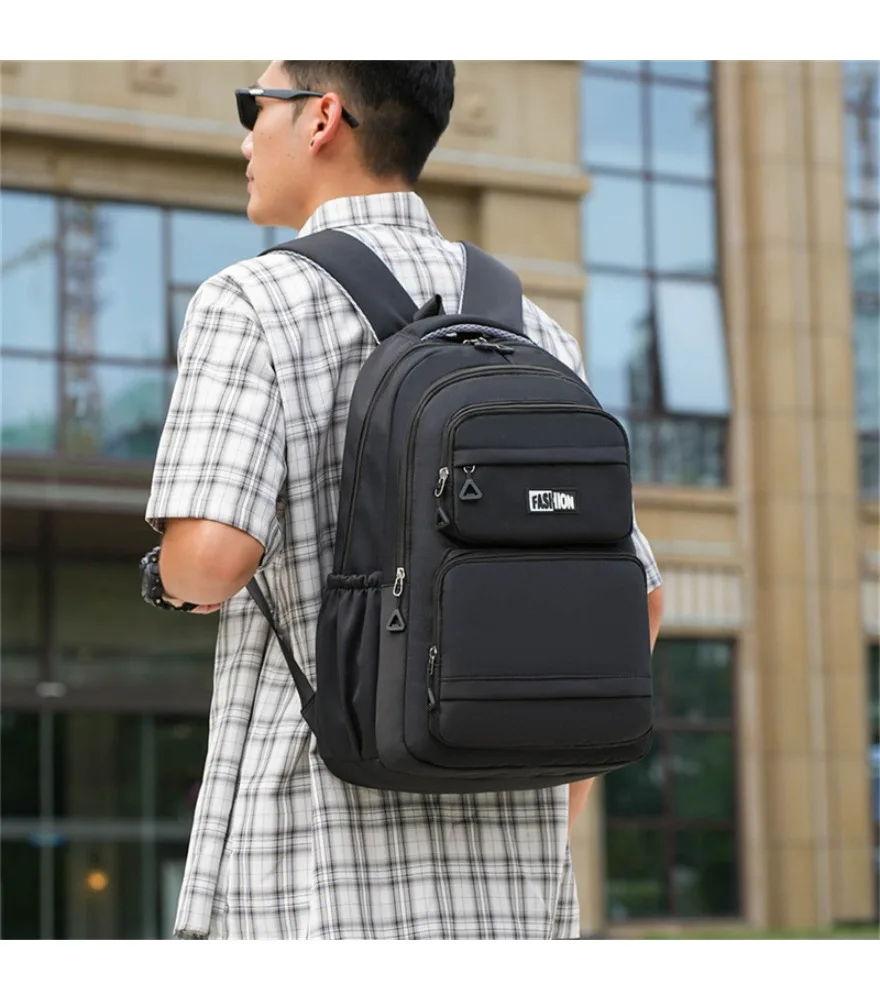 

Black classic multi compartment backpack with fashion front label anti splash spacious inner space for student daily schooling