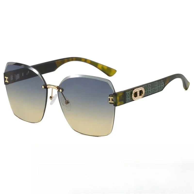 

‌2025 Fashion Rimless Sunglasses Women - Oversized UV400 Cat Eye Glam Shades for Driving & Street Style
