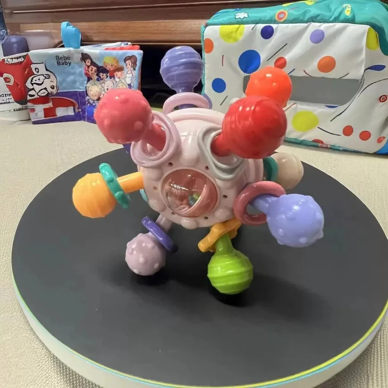Sonajero de bola de dedo de Manhattan infantil, bola de átomo, mordedor giratorio, juguete de dentición, bola de Gel suave