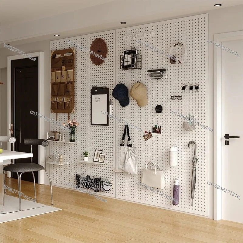 living room, hole board, shelf, whole wall, storage, entrance door, hanging board