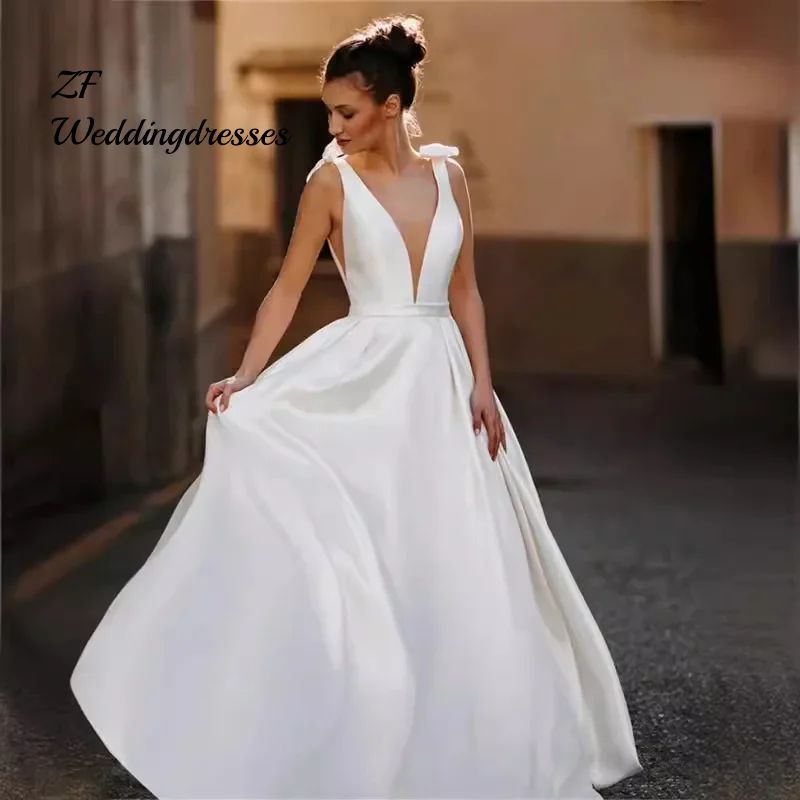 CustomizedTwo Bows Deep V Neck Satin A Line Wedding Dress Open Backless Sweep Train Bridal Gown