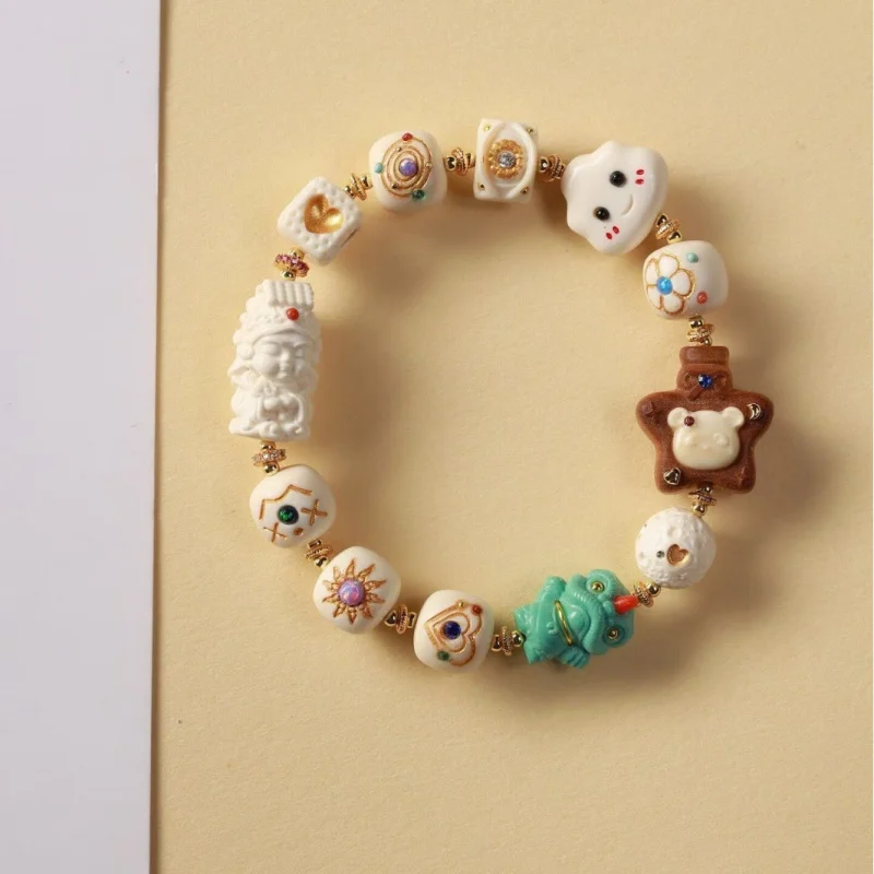 

Браслет из слоновой кости нового дизайна с одной петлей и множеством бусин, украшенный аксессуарами Мазу, — модный китайский культурный аксессуар.