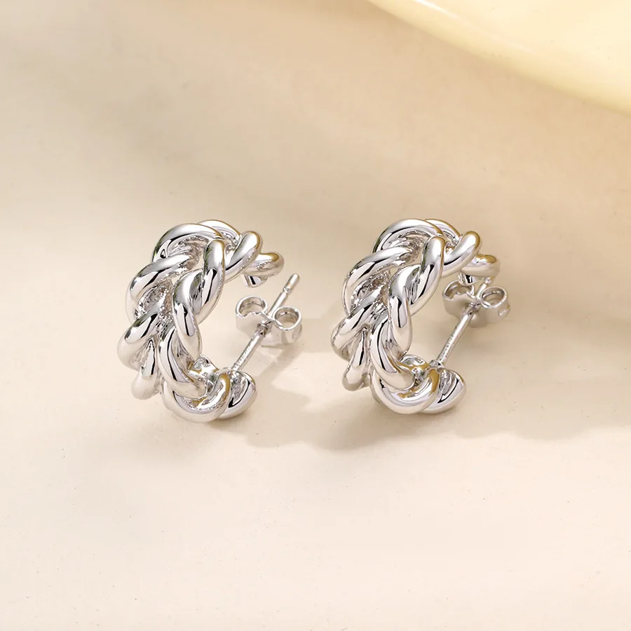 

European and American light luxury small gold twist earrings women's niche design sense high-end stud earrings and ear jewelry