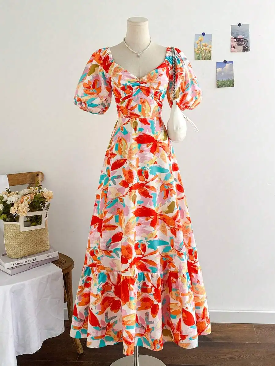 

Женское макси-платье с цветочным принтом, пышными рукавами и оборками по низу