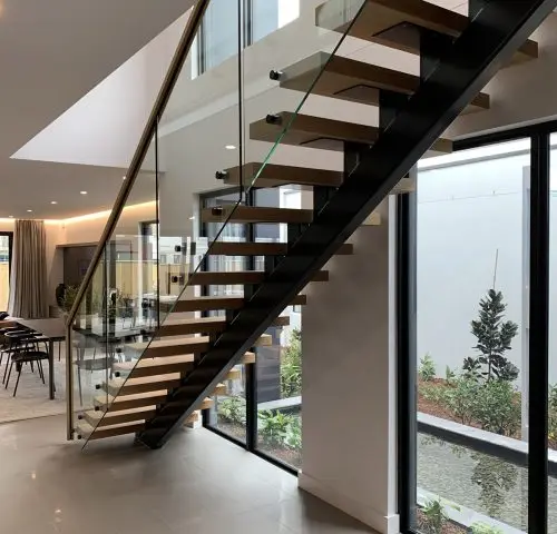 Customized floating straight ladder LED glass railing steel and wood environmentally friendly stairs, suitable for indoor hotels