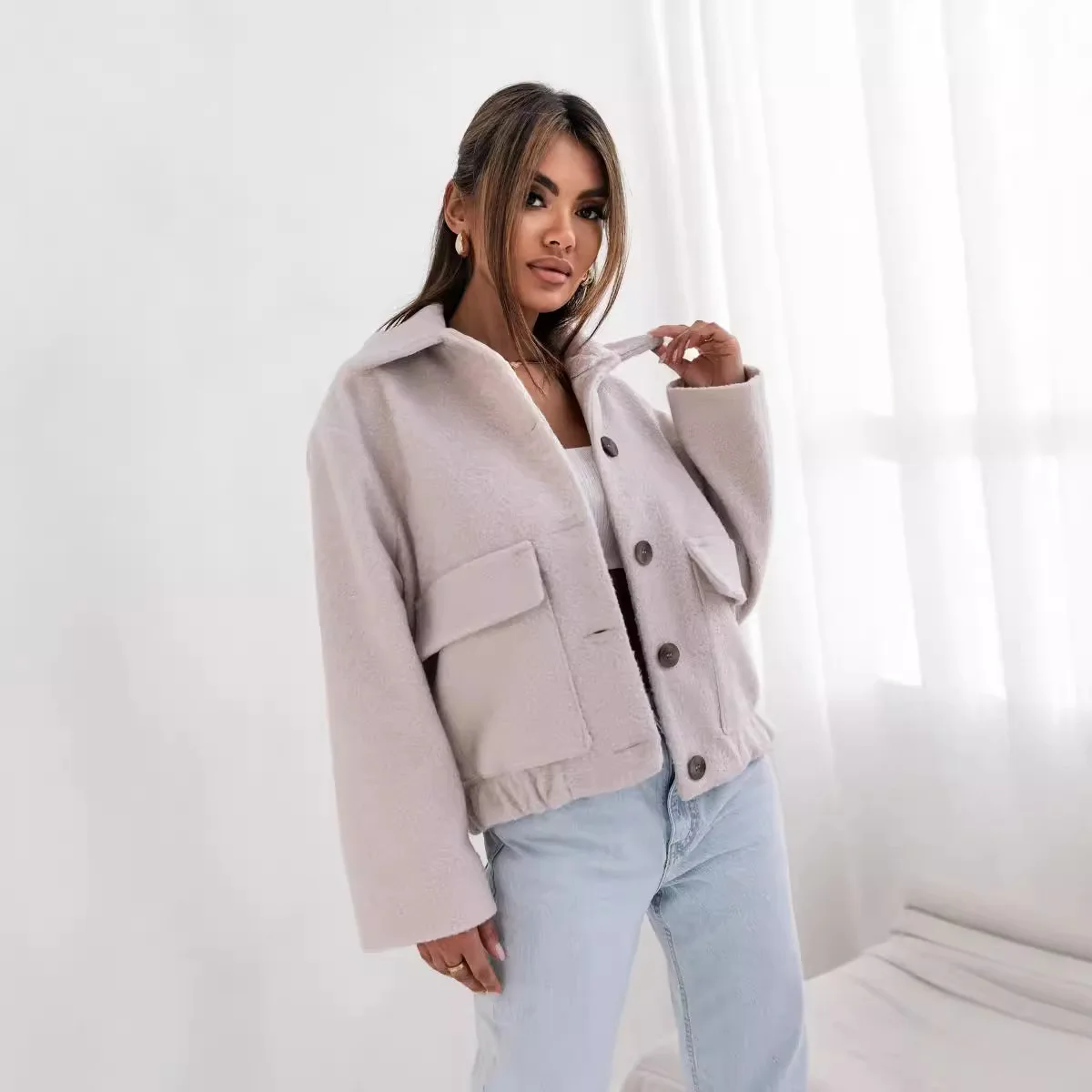 2025 nouvelle mode bouton tricoté revers veste femmes hiver décontracté ample couleur unie poche à manches longues veste femmes