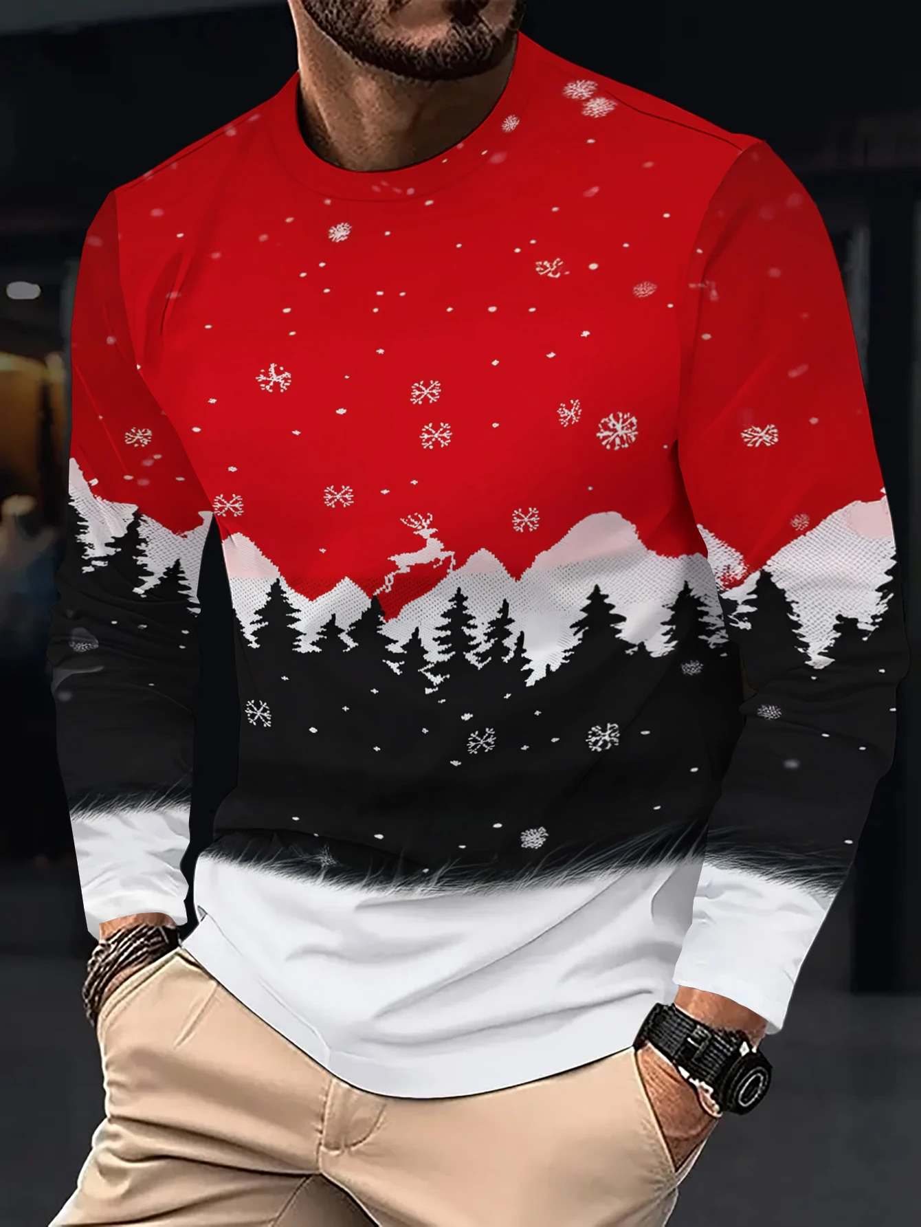 Christmas-themed long-sleeve T-shirt featuring a patchwork design of snowy mountains, reindeer, and snowflakes