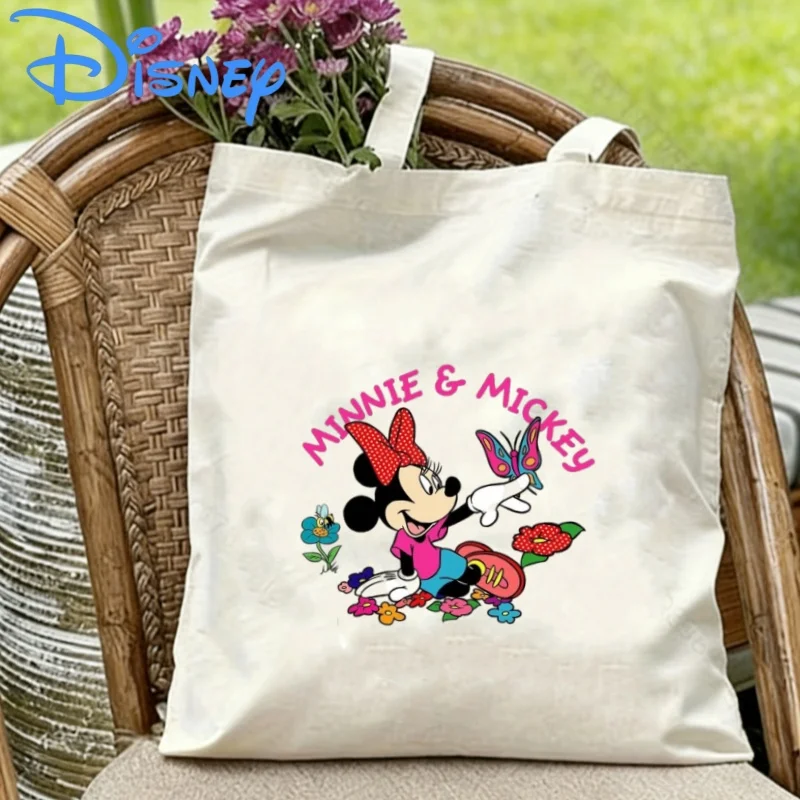 1 bolso de hombro de lona de doble cara con estampado floral y de mariposas de Minnie Mouse de Disney, bolso ecológico
