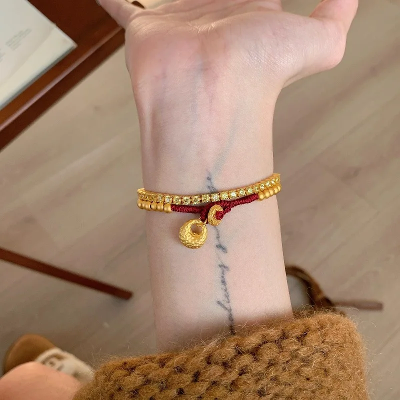 New in antique gold crafts round beads Yuanbao style bracelets red woven rope bag bracelet light luxury simple banquet jewelry view 2