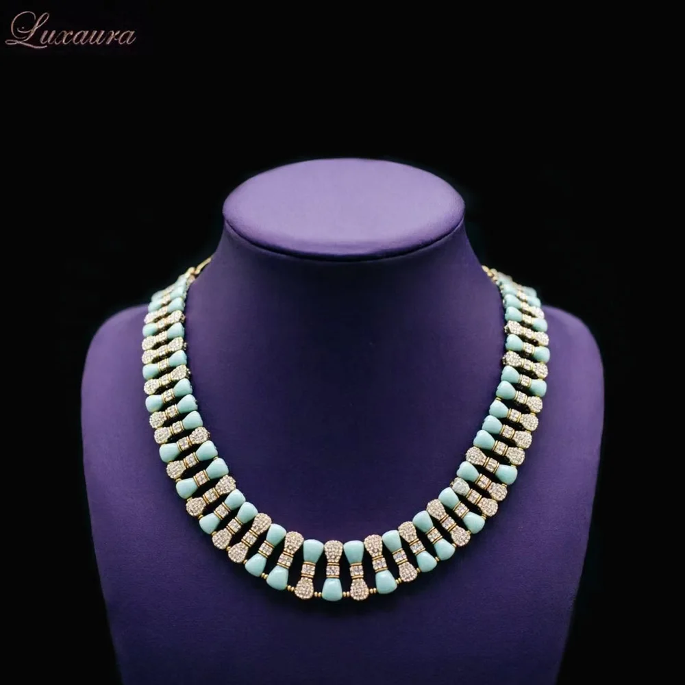 

Vintage jewelry featuring a fashionable and classic blue geometric necklace design paired with Bohemian style women's necklace