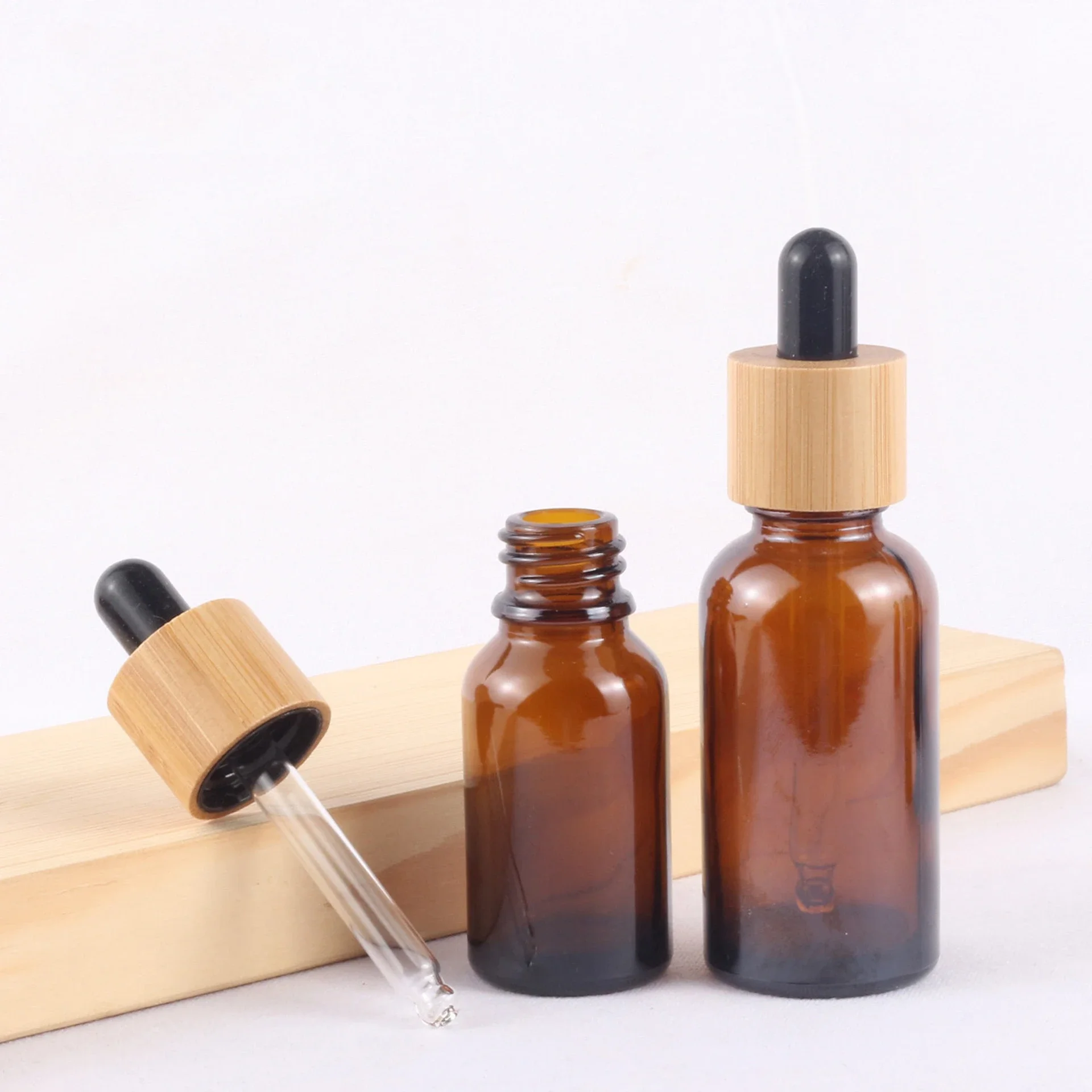

mini portable CBD Recycled eco friendly Round Natural Bamboo Wooden Lid Frosted Brown Glass Dropper Bottle with Rubber Cap