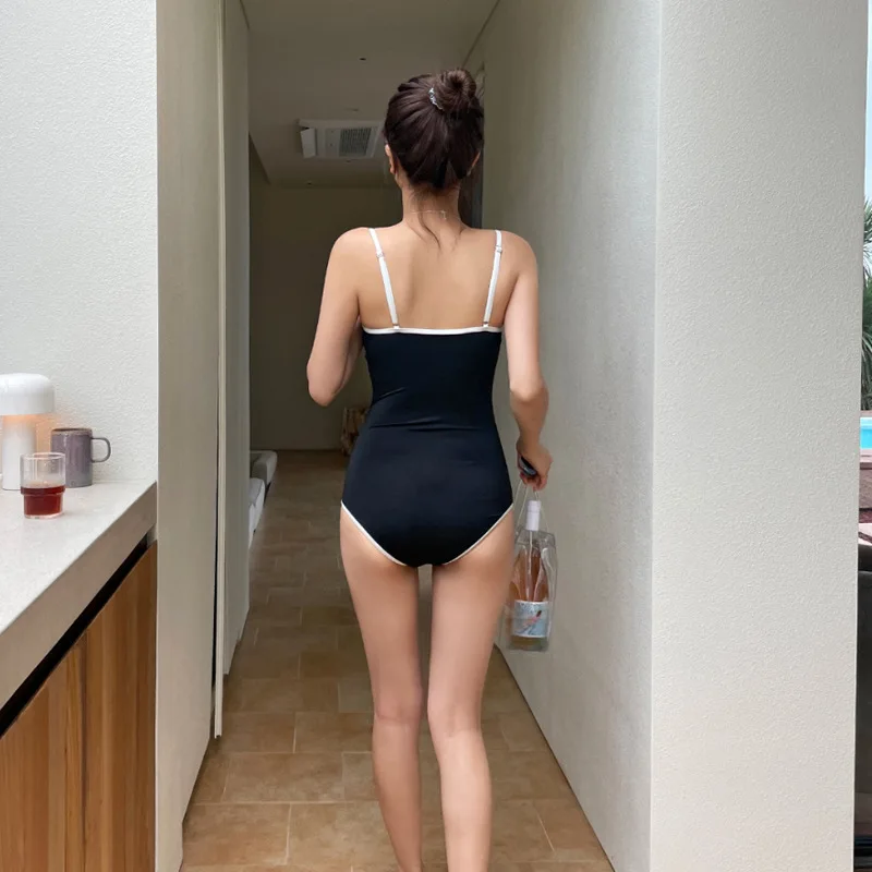 Traje de baño de una pieza con espalda descubierta para mujer, bañador Sexy, ropa de playa de moda coreana Simple, traje de baño de cintura alta para vacaciones y viajes