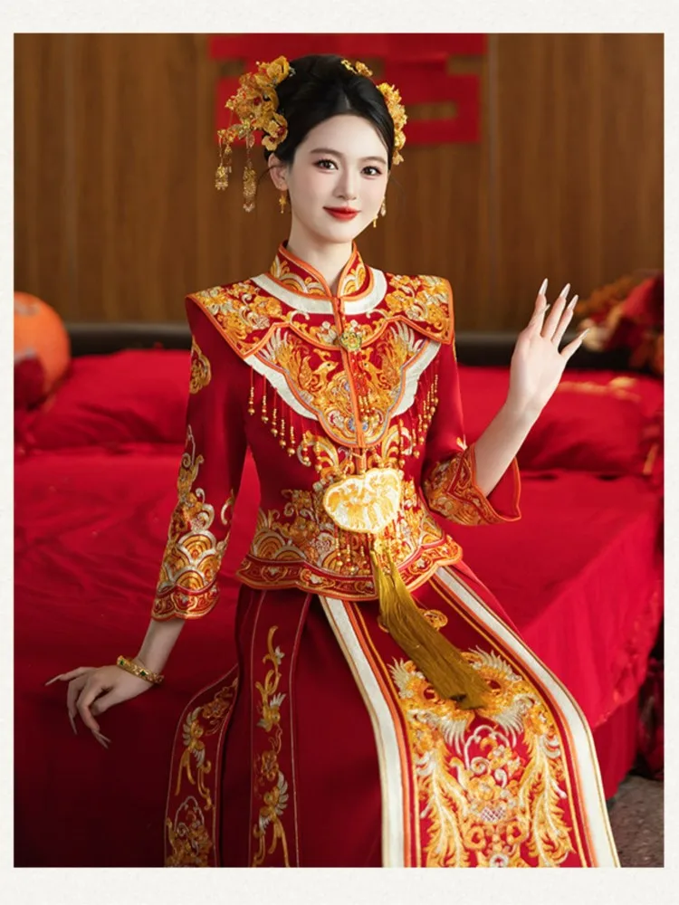 The new style of dragon and phoenix gown features a figure a dress draped in traditional Chinese ceremonial attire