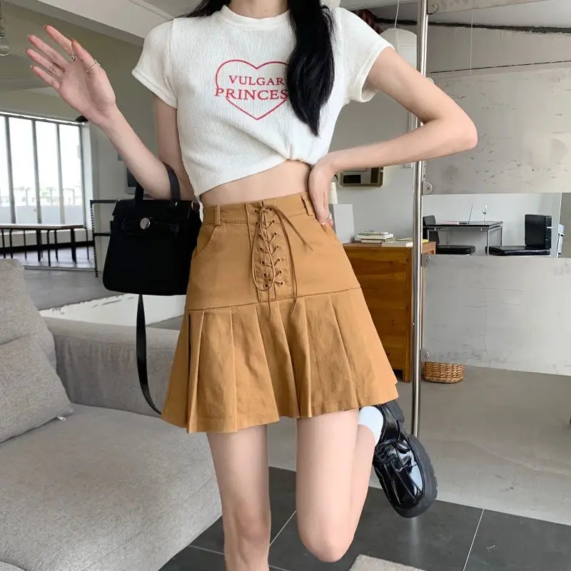 Fashion Solid Color Bandage Pleated Skirts Female Clothing 2025 Summer New Loose Preppy Style Zipper High Waist Mini Skirts