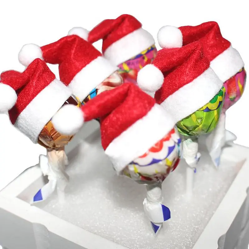 

10pcs Mini Santa Hats Non Woven Fabric Christmas Tree Decoration Party Supplies Table Decorations Lollipop Shape naments Holiday