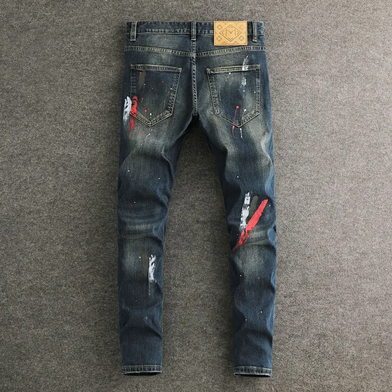 Moda urbana hombres Jeans Retro lavado azul elástico pintado rasgado Jeans hombres parcheado diseñador Hip Hop Vintage pantalones vaqueros delgados