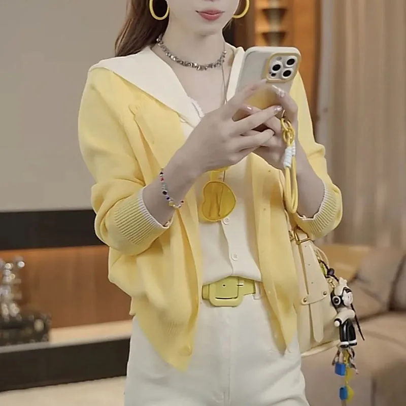 Autumn 2026 women's Korean contrast fake two-piece sweater jacket explosion women's design casual Joker hooded knit cardigan top