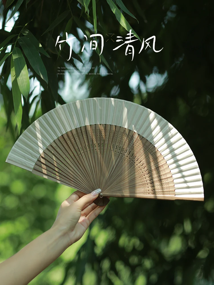 

Folding fan ancient style new Chinese girls cheongsam dance fan hollowed out all bamboo