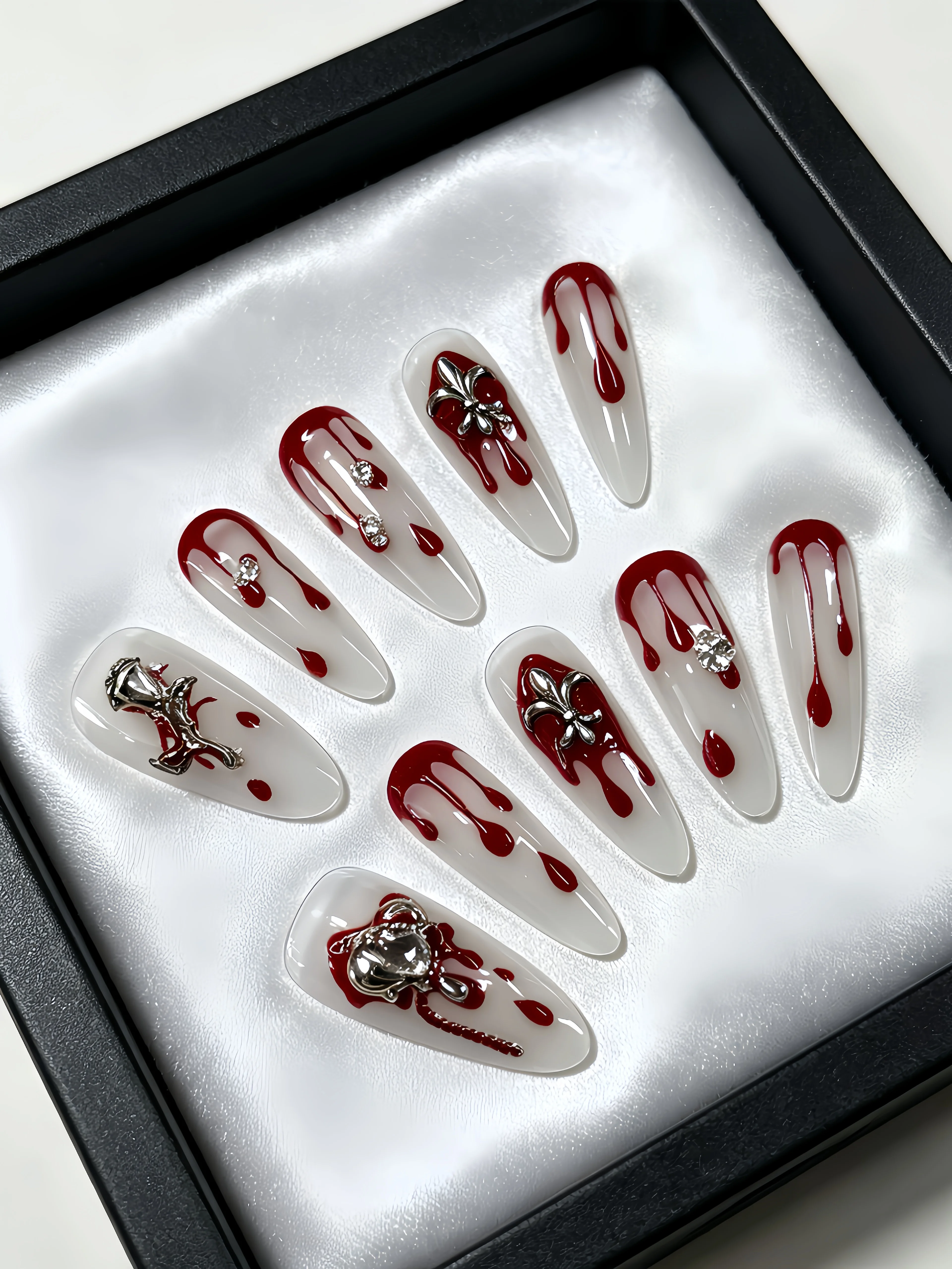 10 Long Waterdrop-Shaped Press-On Nails, with a Milky White Base Color Paired with Red Waterdrop Metal Chain Flower Decorations and Rhinestone Elements, Simple and Stylish Nail Art Patches for Y2K Gothic Style Enthusiasts, Suitable for Daily Use, Work, Office, Bars, Clubbing, Music Festivals, Etc., Punk Style Fake Nails, Suitable for Parties, Swimming, Summer Dates, and Punk Style Nail Art. Includes One Jelly Glue and One Nail File view 2