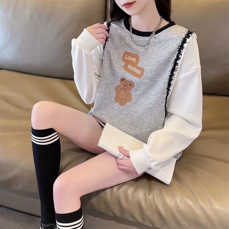 

Large-size round neck sweater women's autumn 2024 new cartoon print stitching contrast design sense Joker long top.