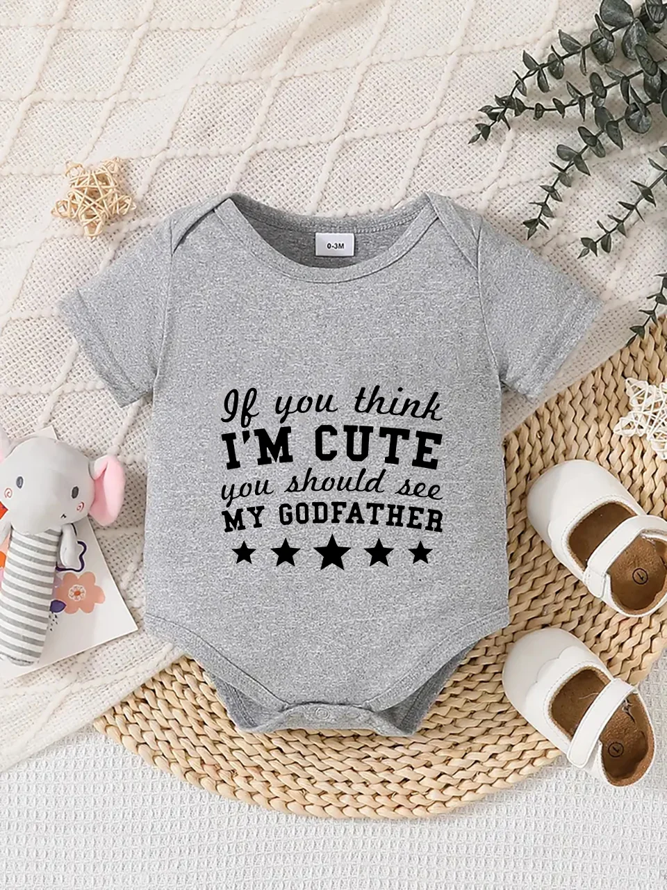 Playful letter-printed baby short-sleeve triangle bodysuit. Button closure for easy dressing, machine washable